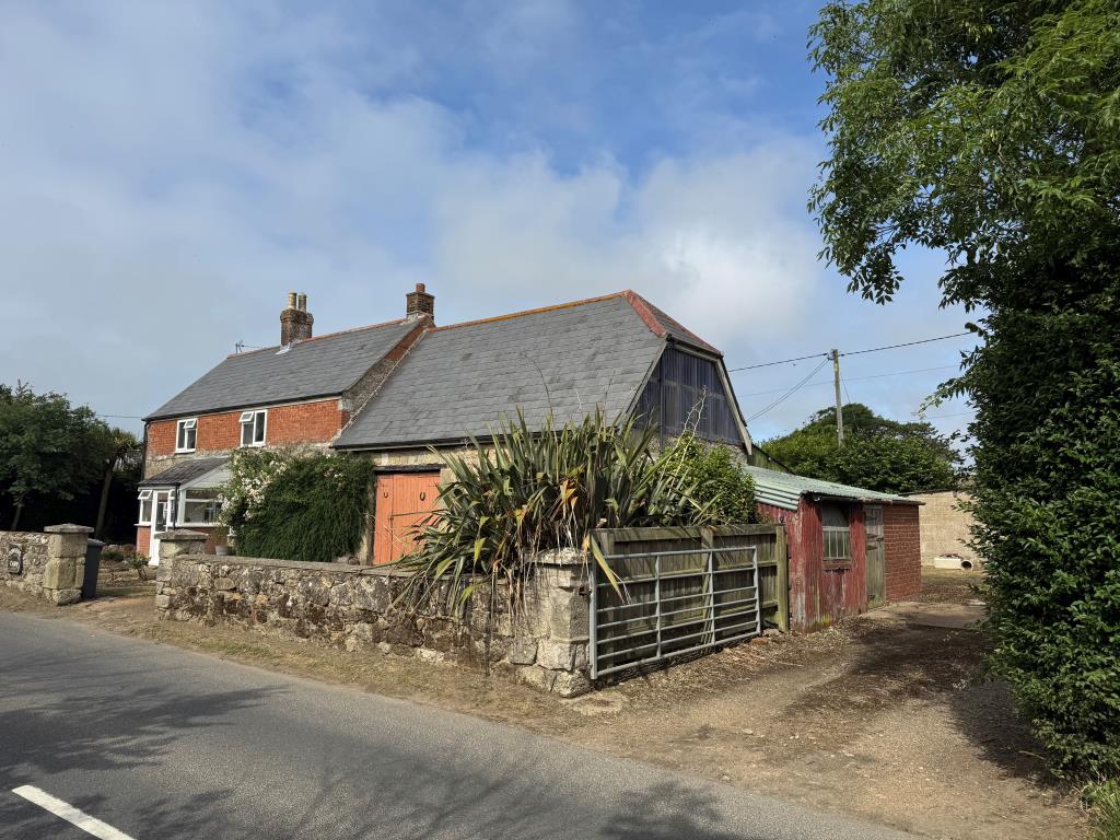 Lot: 53 - TRADITIONAL FARMHOUSE FOR IMPROVEMENT WITH BARNS AND OUTBUILDINGS ON A 2.5 ACRE PLOT - View of the Front of the Barn and the Vehicular Access to the Farmyard